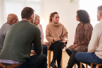 Group of people talking during therapy