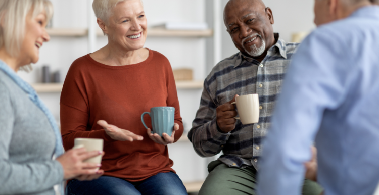 An image of a focus group taking place between some men and women who are talking to eachother.