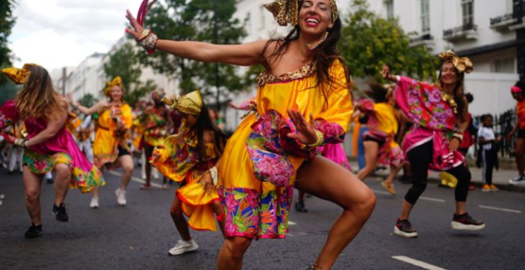 An image of dancers going through the Notting Hill Carnival parade.