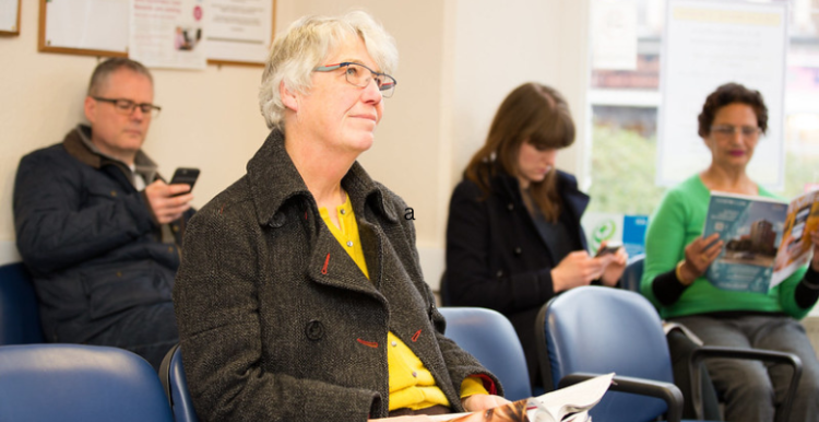 Female patient waiting for her appointment at the GP clinic.