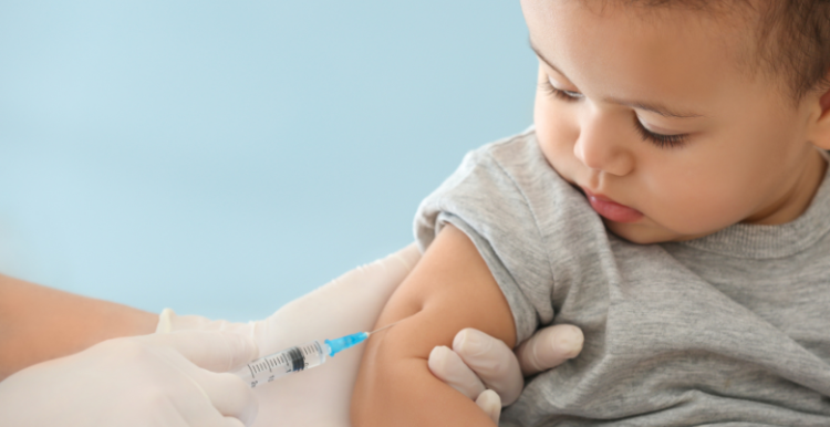 Picture of a baby receiving a vaccine.