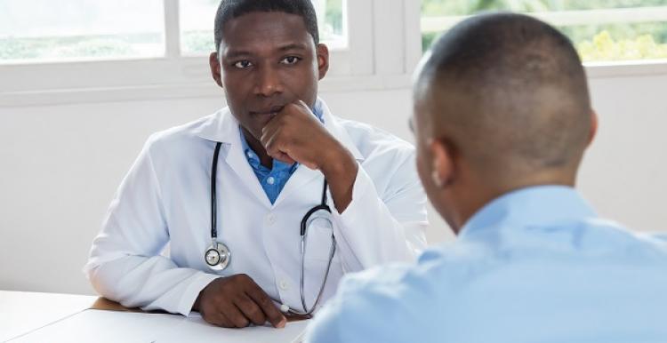 A medical professional speaking to a patient.