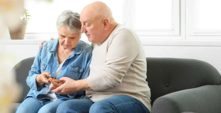 A senior couple checking their diabetes at home