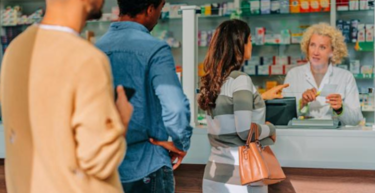 Customers waiting in line at a pharmacy