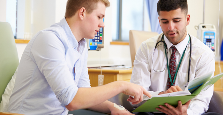 Doctor and patient looking at medical records together