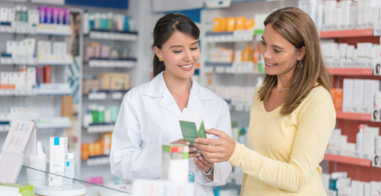 Female pharmacist assisting a female patient at the pharmacy
