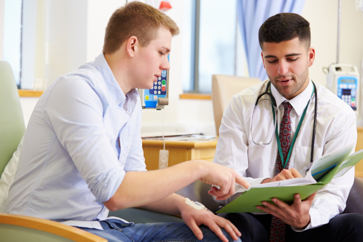 Doctor and patient looking at medical records together
