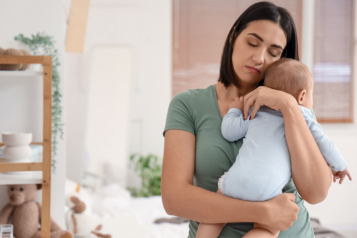 Mother holding baby in her arms