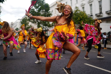 An image of dancers going through the Notting Hill Carnival parade.