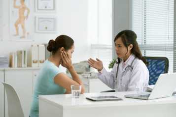 A doctor talking to a patient at the clinic
