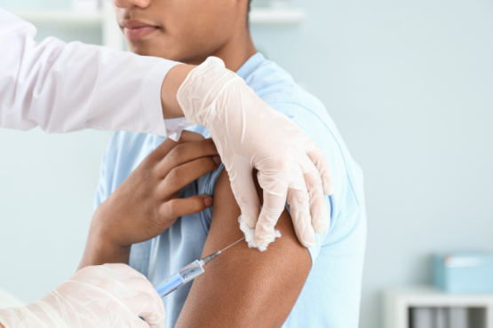 A young boy receives a vaccination.