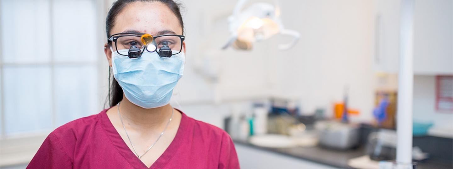 Lady with mask in a dental practice