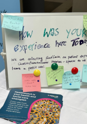 A picture of a whiteboard with post it notes of people's feedback during engagement events.