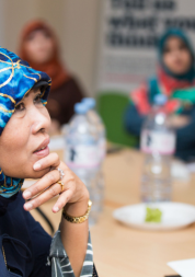 A group of women sitting around a table during a discussion.