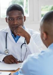 A medical professional speaking to a patient.